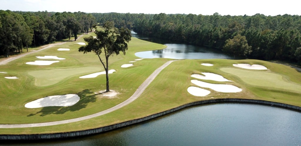 View of golf course bunkers and trees